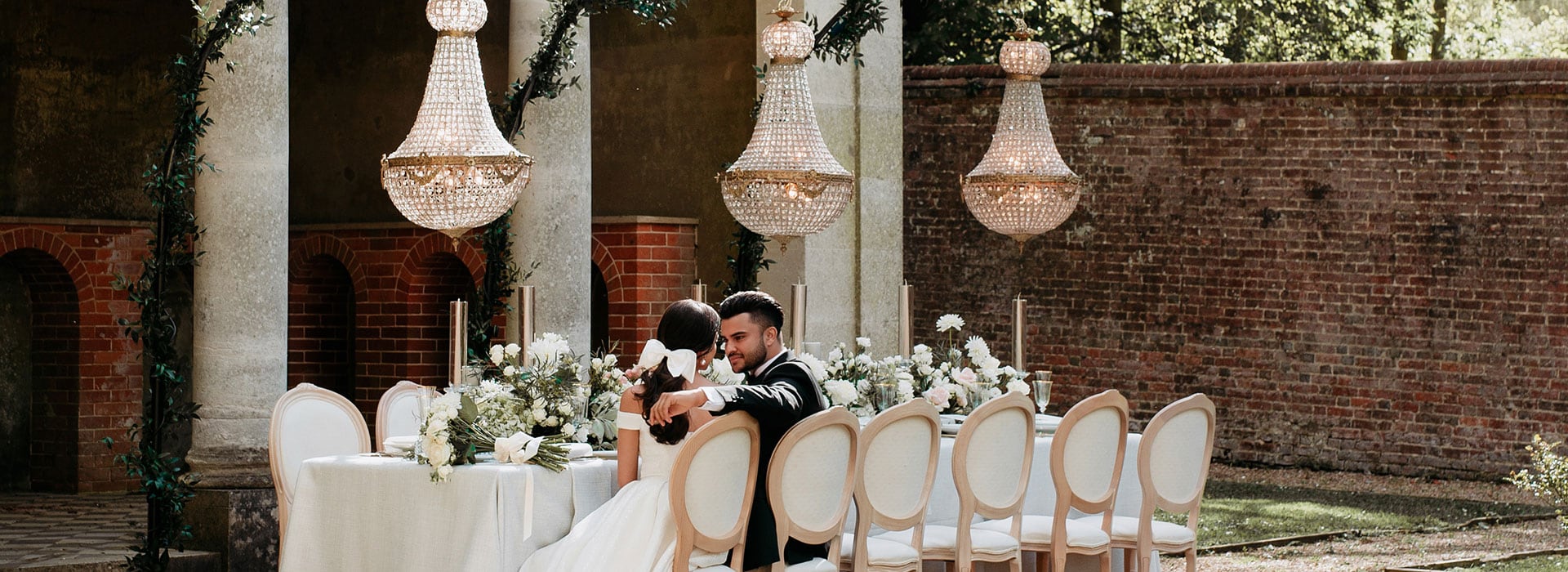 The Secret Table with Empire Chandeliers on chandelier stands