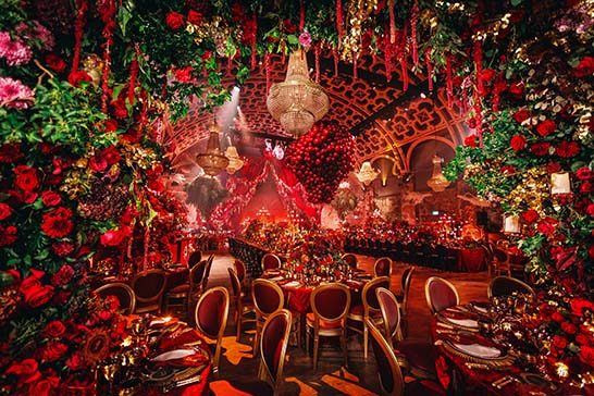 Fantasia private party with chandeliers and red roses decor