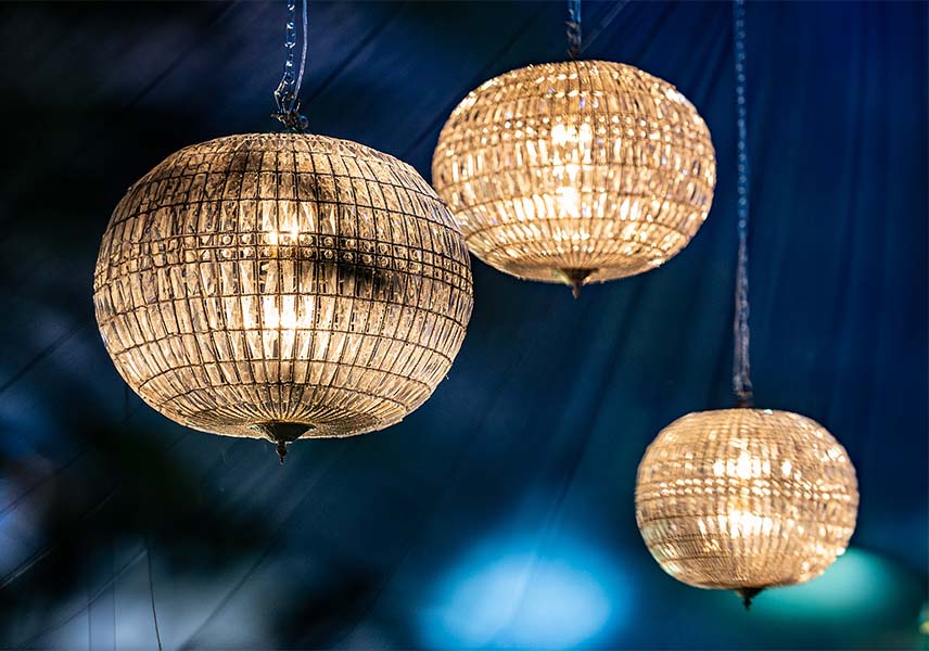 Crystal Lanterns at Bohemia promo in dark blue drape marquee