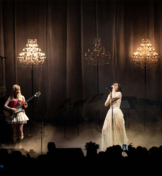 Girl band on stage with Marie Therese 88 floor standing chandeliers