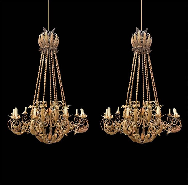 Floristry chandelier with electric candle fittings on black background