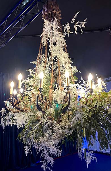 Electric Floristry wrought iron chandelier dressed in foliage